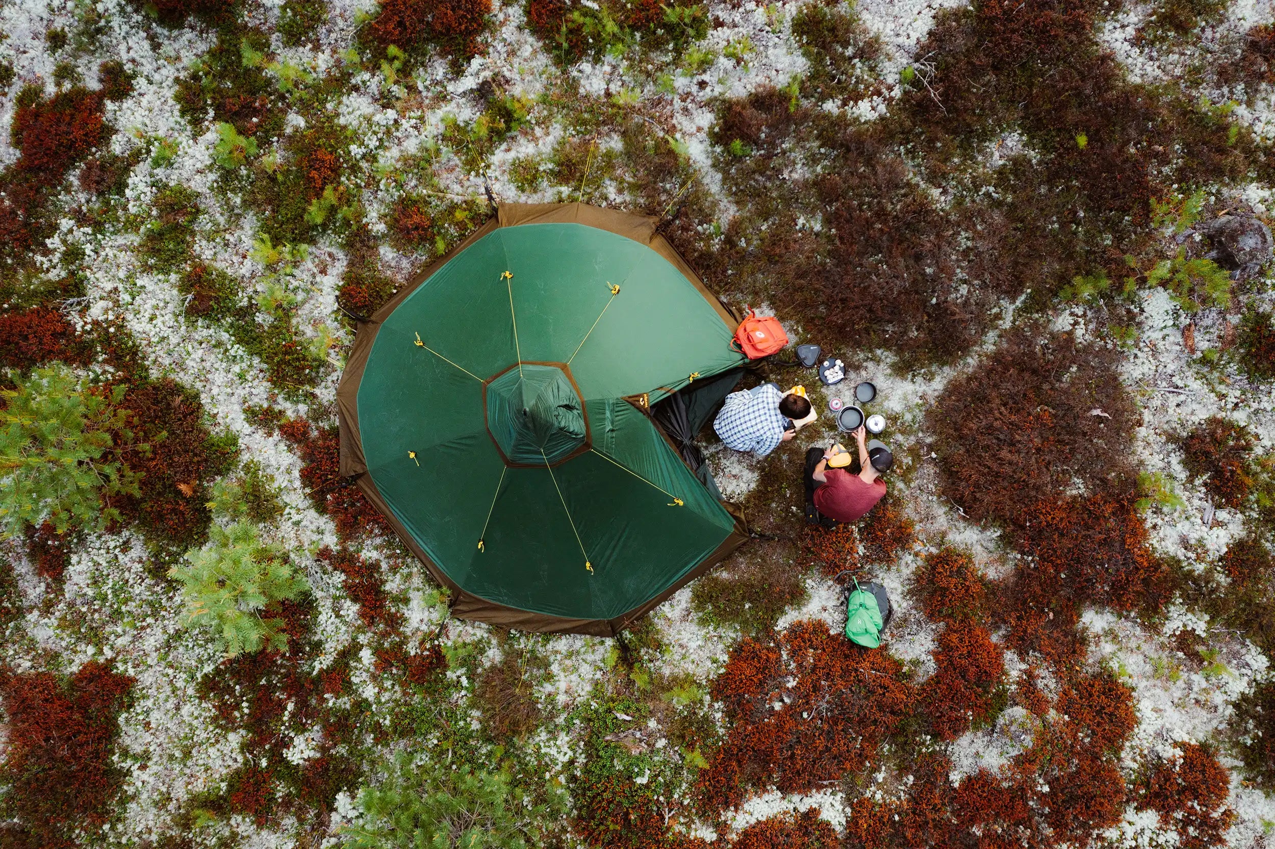 Camping couple cooking food outside lightweight Nordic tipi tent