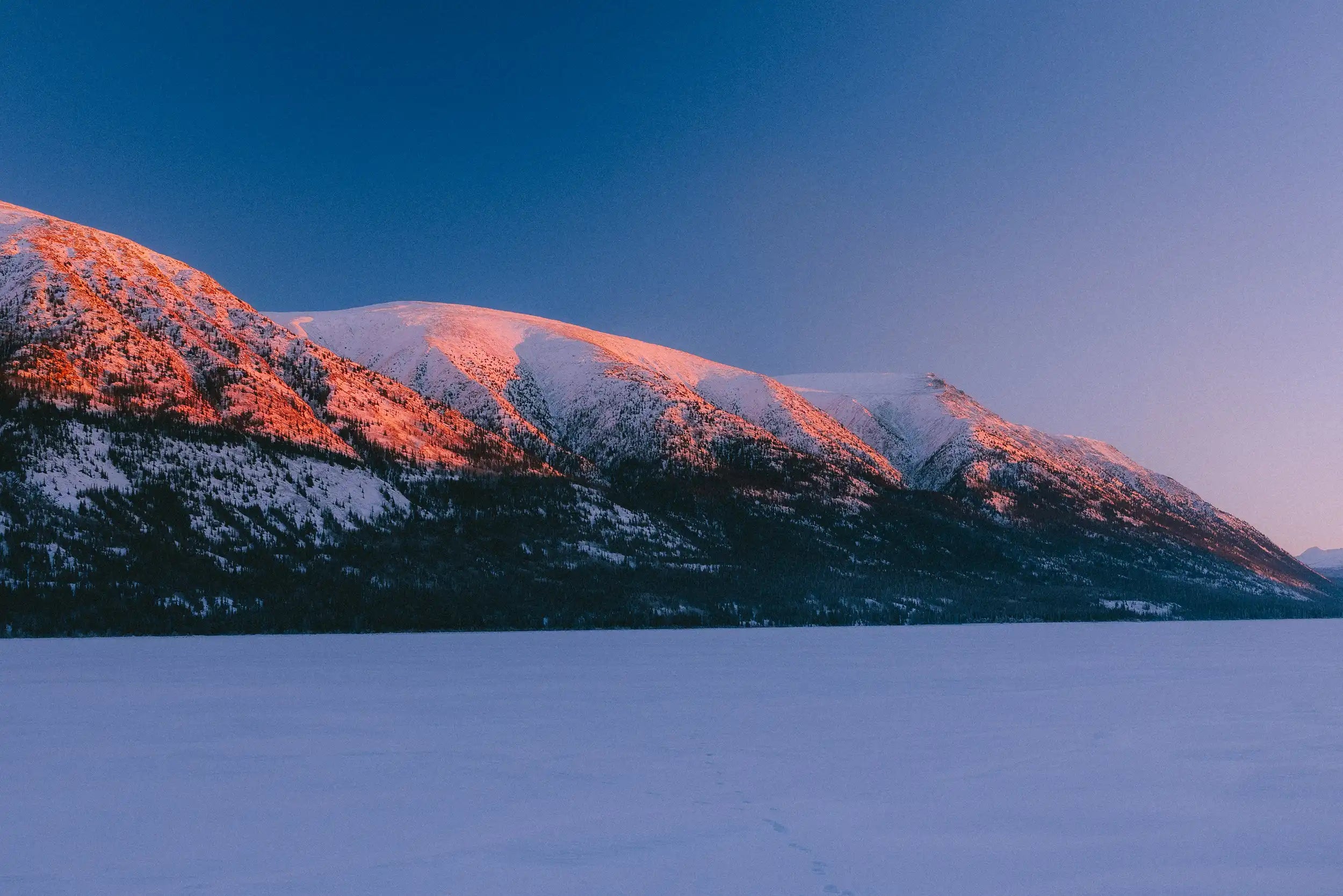 Snowy mountains surrounding a camping site Safir 7 cp from Tentipi