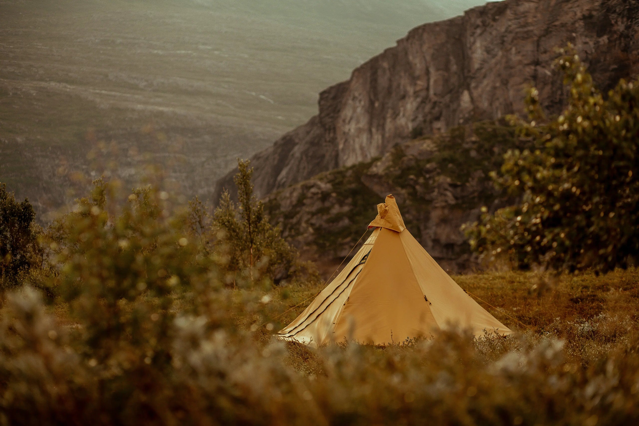 Canvas camping tent Olivin 2 cp pitched in scenic landscape in Norway