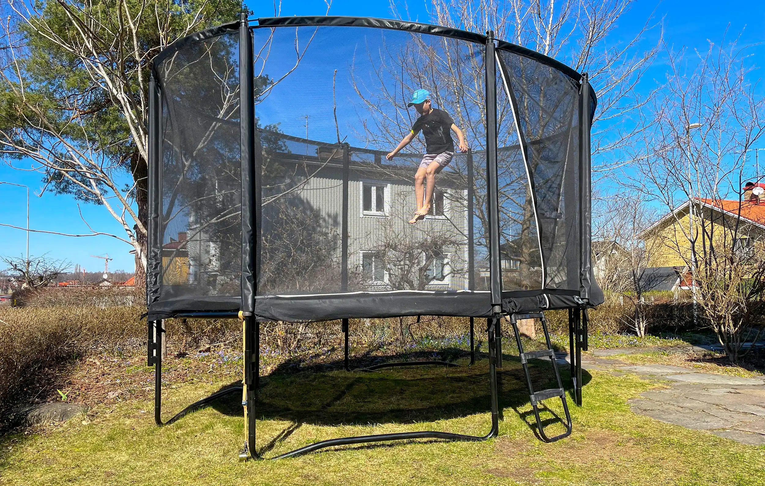 Anchoring set trampoline used in the garden to prevent blowing away