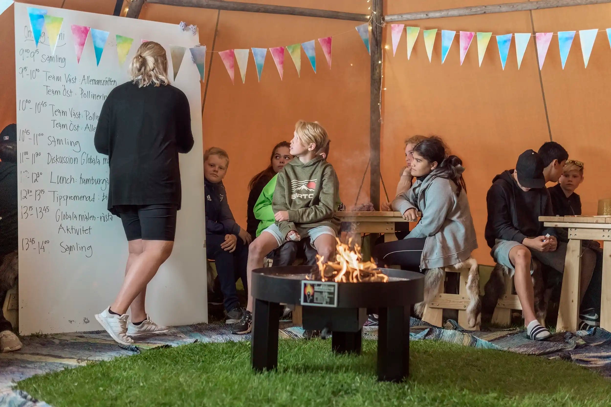 heated outdoor education classroom wood burning fireplace finnmark Tentipi canvas event tent